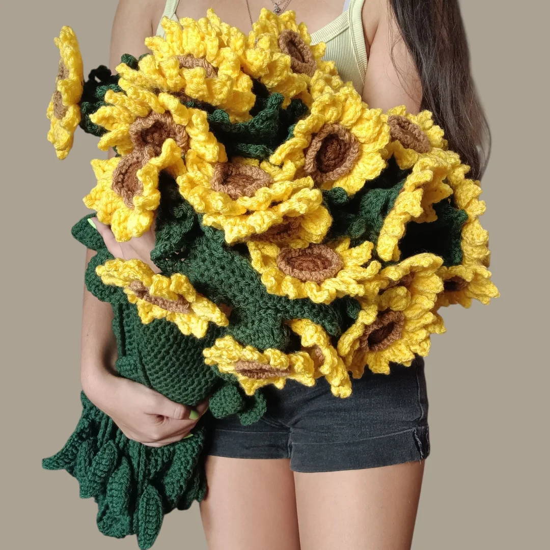 Handmade crochet sunflower bouquet held in two hands
